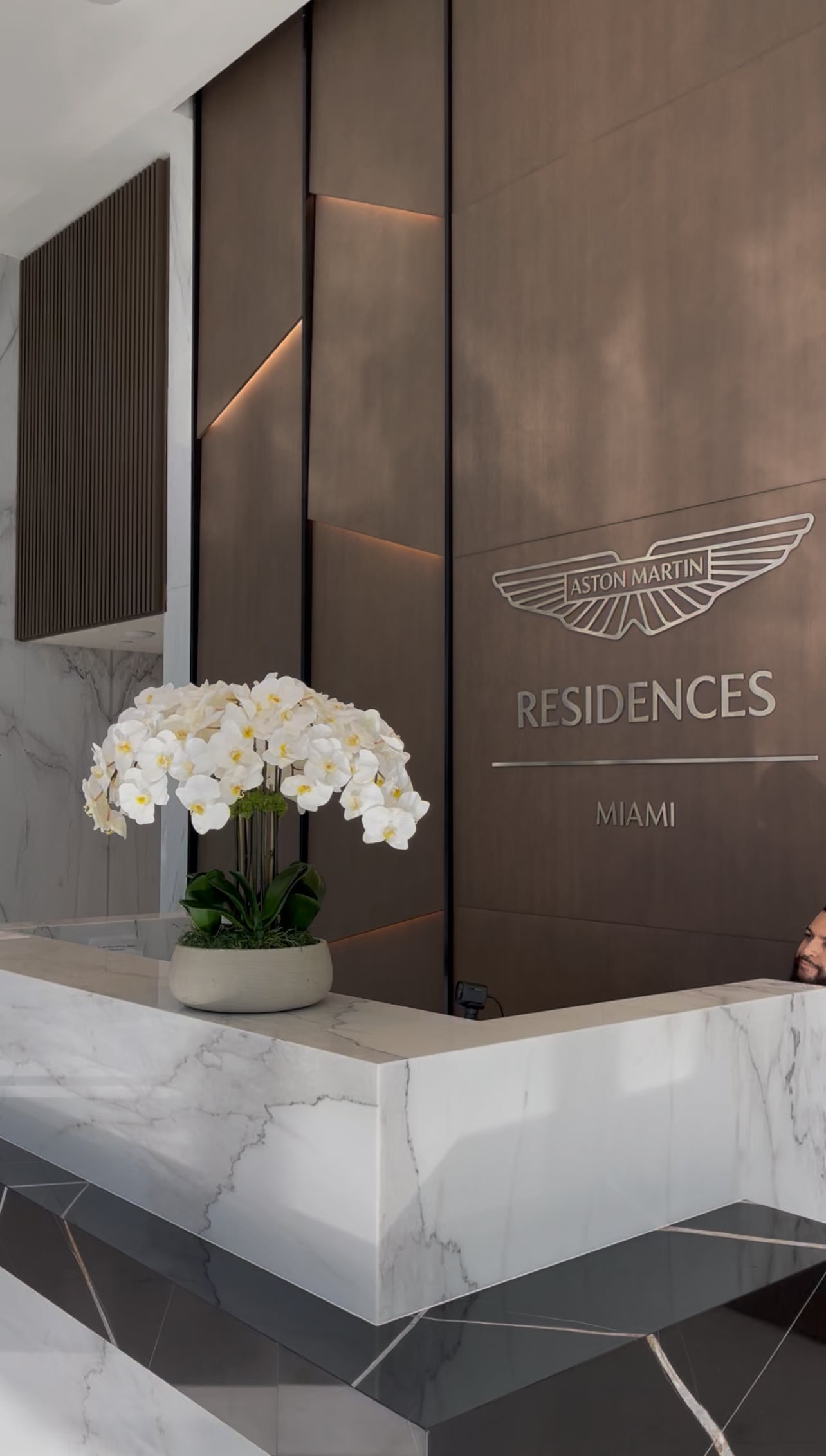 Faux White Orchid Flower Composition in Ceramic Vase and Natural Moss