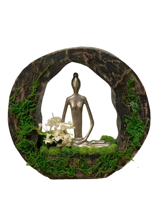 Lady Mediating in a Natural Wood and Moss Garden